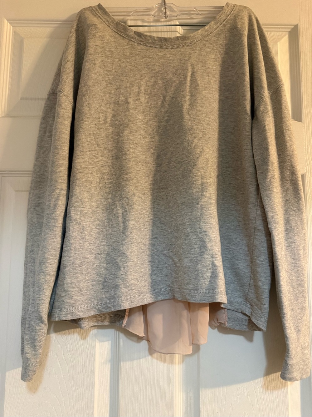 Heather gray long sleeve top with a sheer nude/beige chiffon back panel